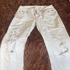 Vintage Hydraulic Women'Distressed very light blue Wide Bottom Jeans. Size 5/6.